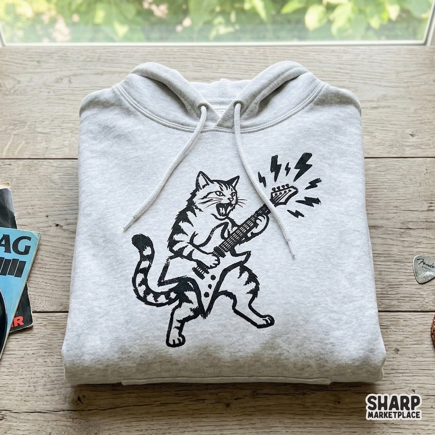 Hand-drawn feline metal design featuring a cat playing guitar, suitable for DTF printing, heat transfers, and DIY projects for music and cat lovers.