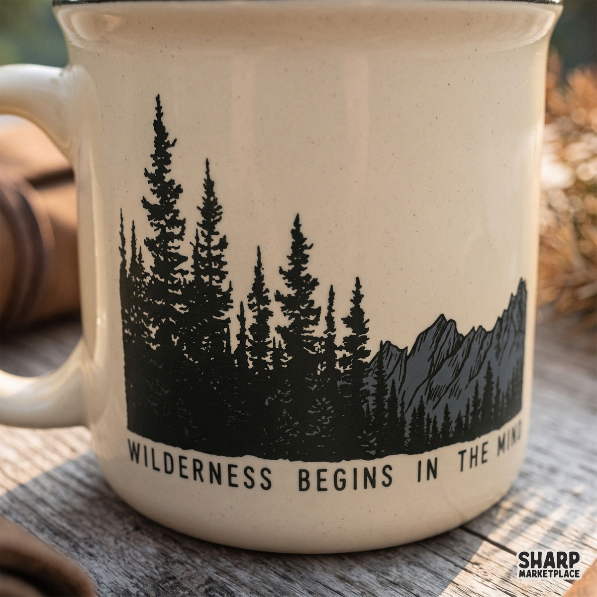 Wilderness Begins In The Mind vintage camping png graphic featuring pine trees and western retro mountain illustration