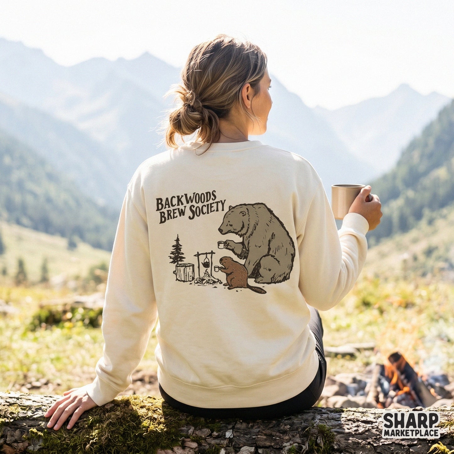 Rustic campfire scene with a bear and beaver holding coffee mugs, designed for sublimation transfers on mugs, apparel, or woodland wall art.