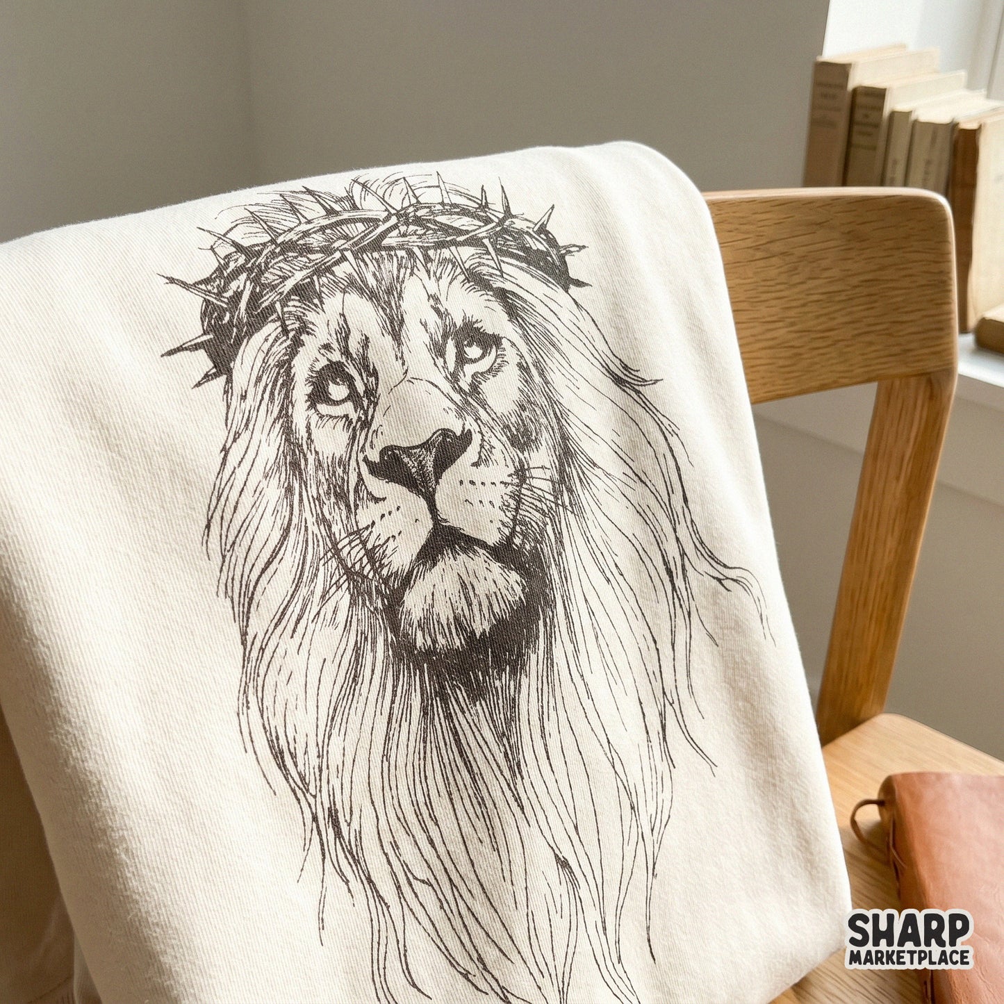 Intricate lion face illustration with a crown of thorns, designed as a high-resolution PNG for t-shirt printing and religious decor.