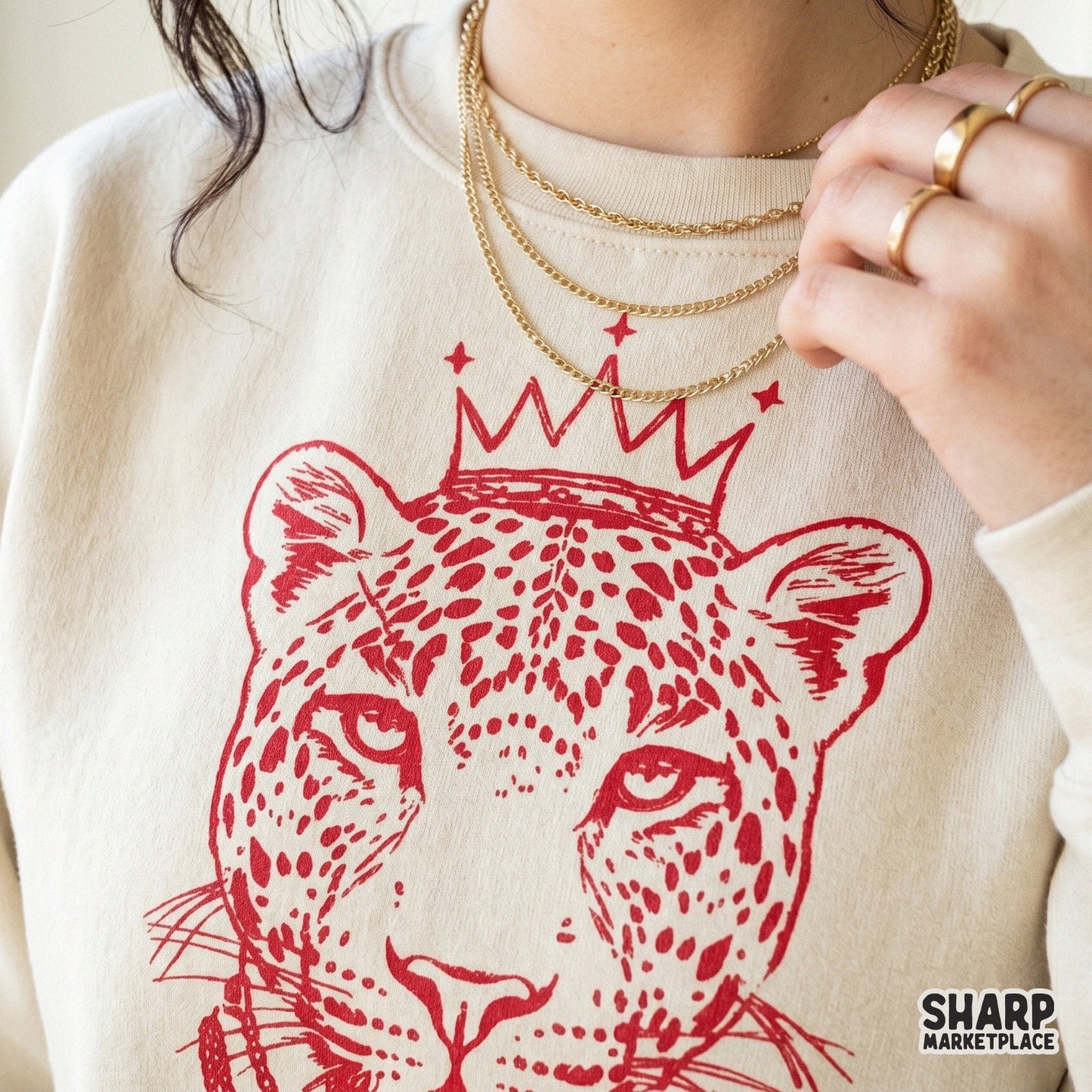 Fierce leopard queen digital design with crown and layered chains, featuring bold hand-lettered text for high-fashion apparel and wall art prints.