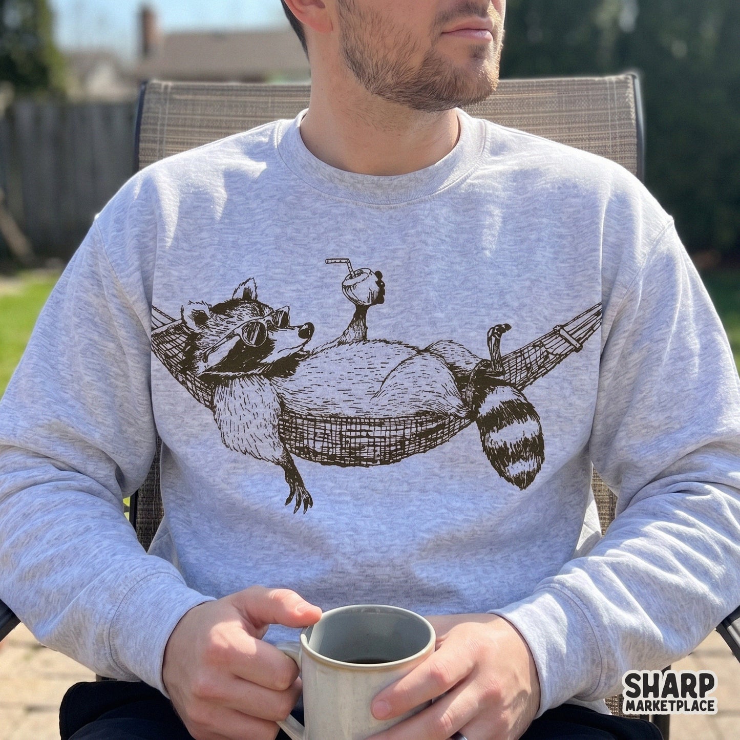 Vintage retro raccoon relaxing in a hammock drinking coconut summer shirt design png