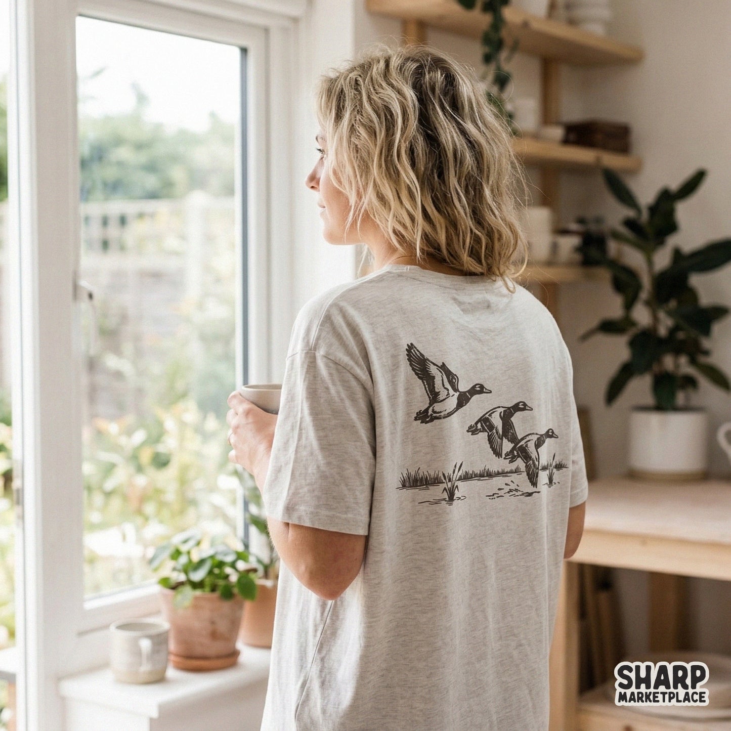 Monochromatic waterfowl flight design featuring a trio of ducks and marsh reeds, ideal for creating rugged graphic tees, tumblers, and nature-inspired art.