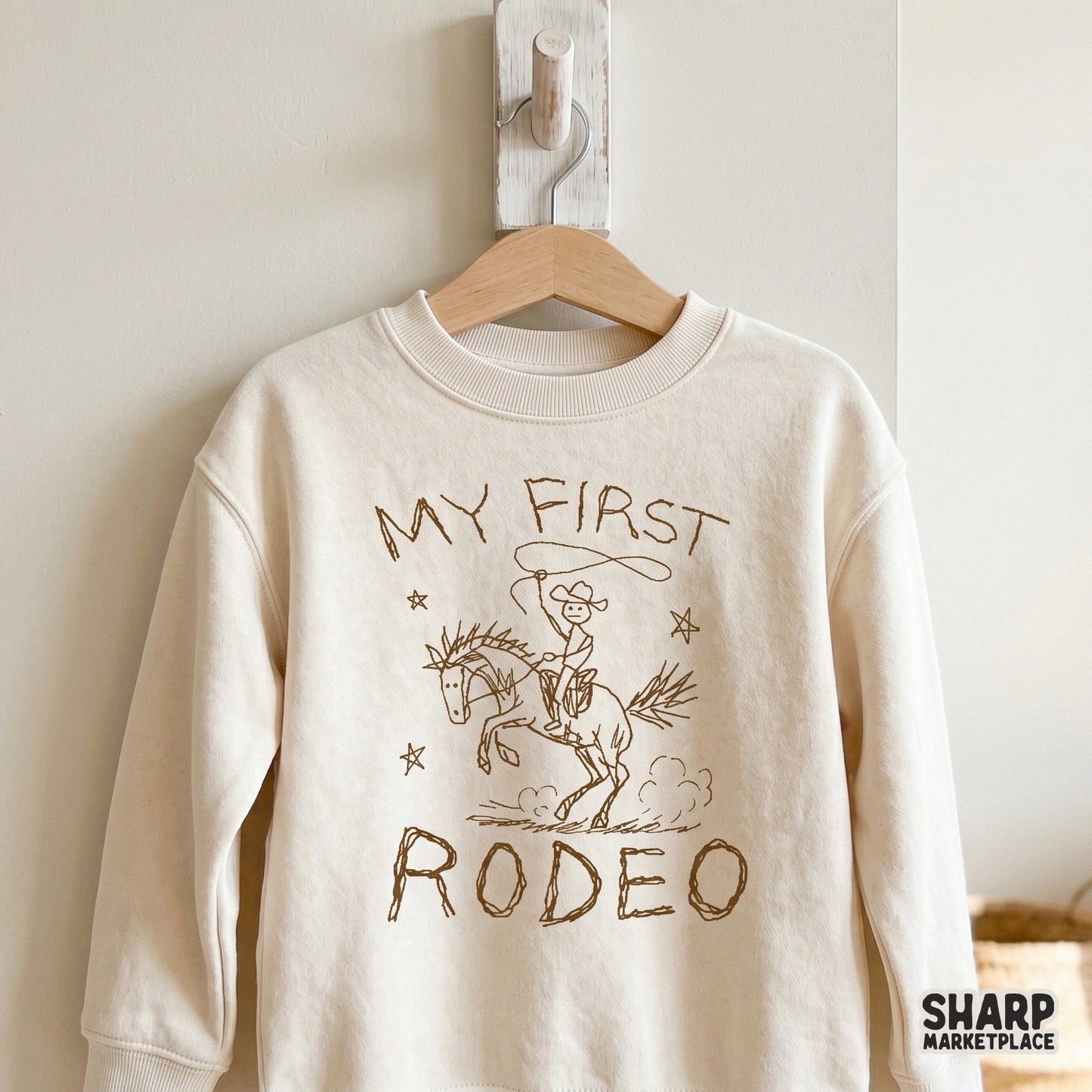 Charming monochromatic western graphic with a stick-figure cowboy and bucking bronco, suitable for DTF transfers, stickers, and custom apparel.