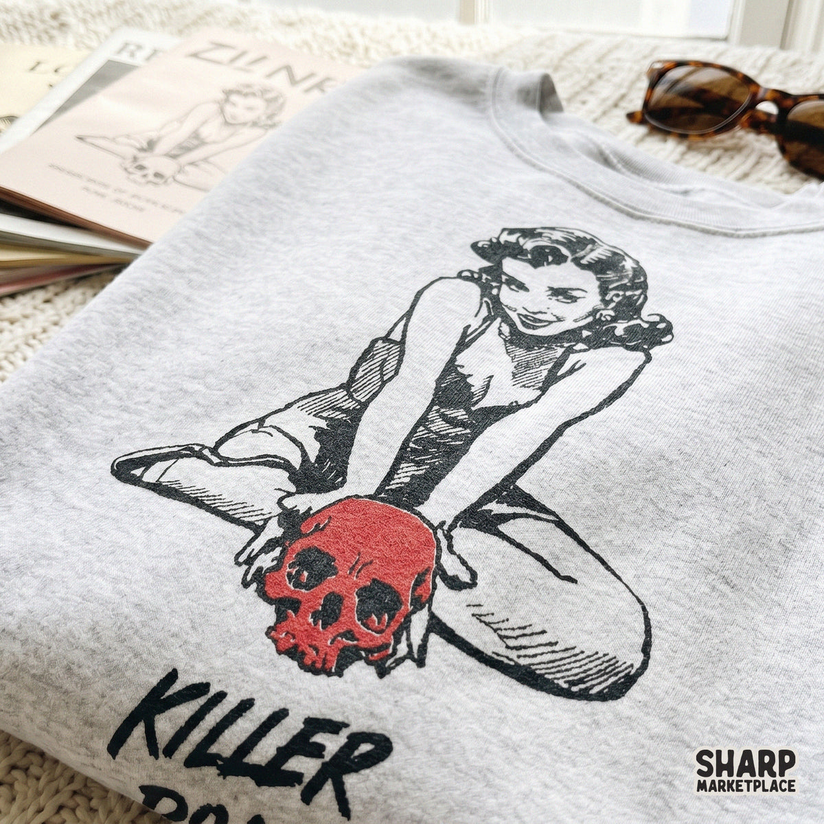 Creepy cute pinup girl art with a bold red skull and distressed text for unique horror themed apparel and DIY spooky craft projects