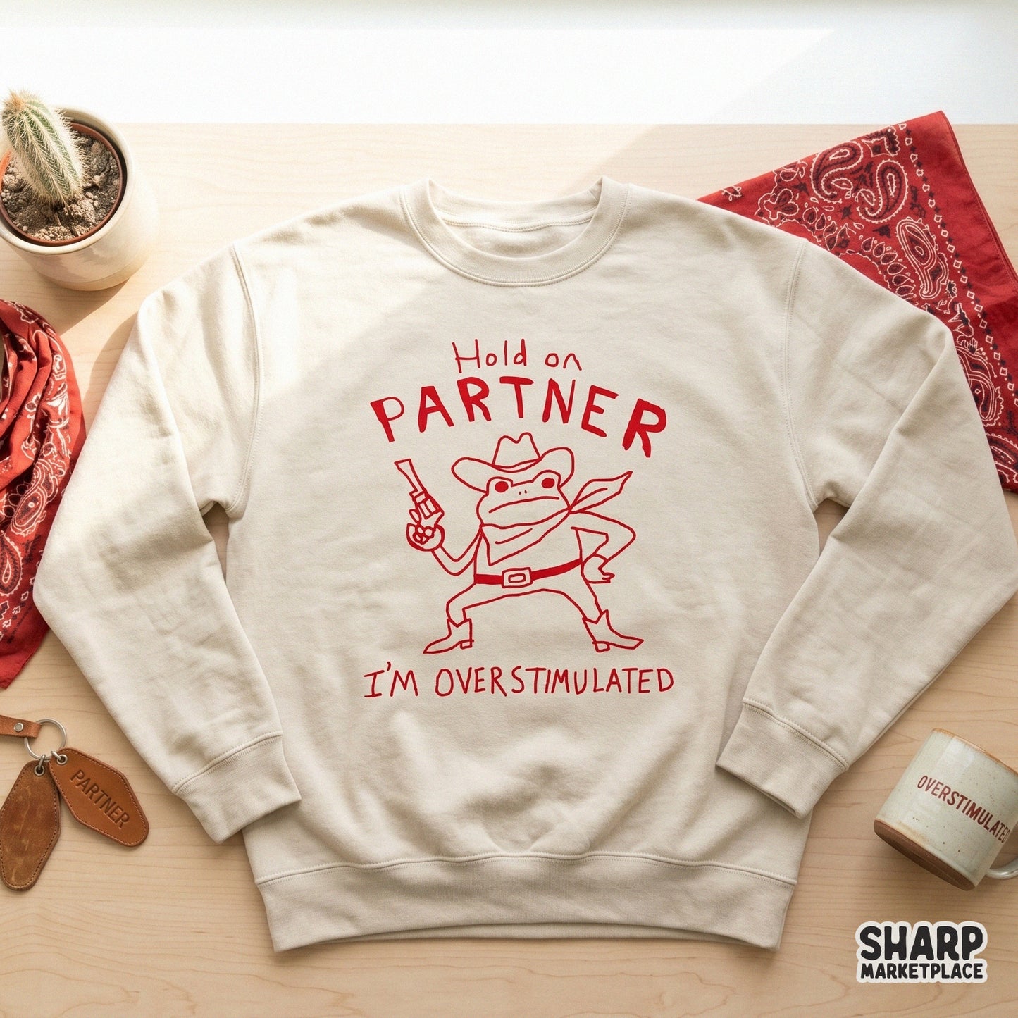 Red monochromatic cowboy frog illustration with a western hat and revolver, designed for digital printing on clothing, accessories, or home decor.