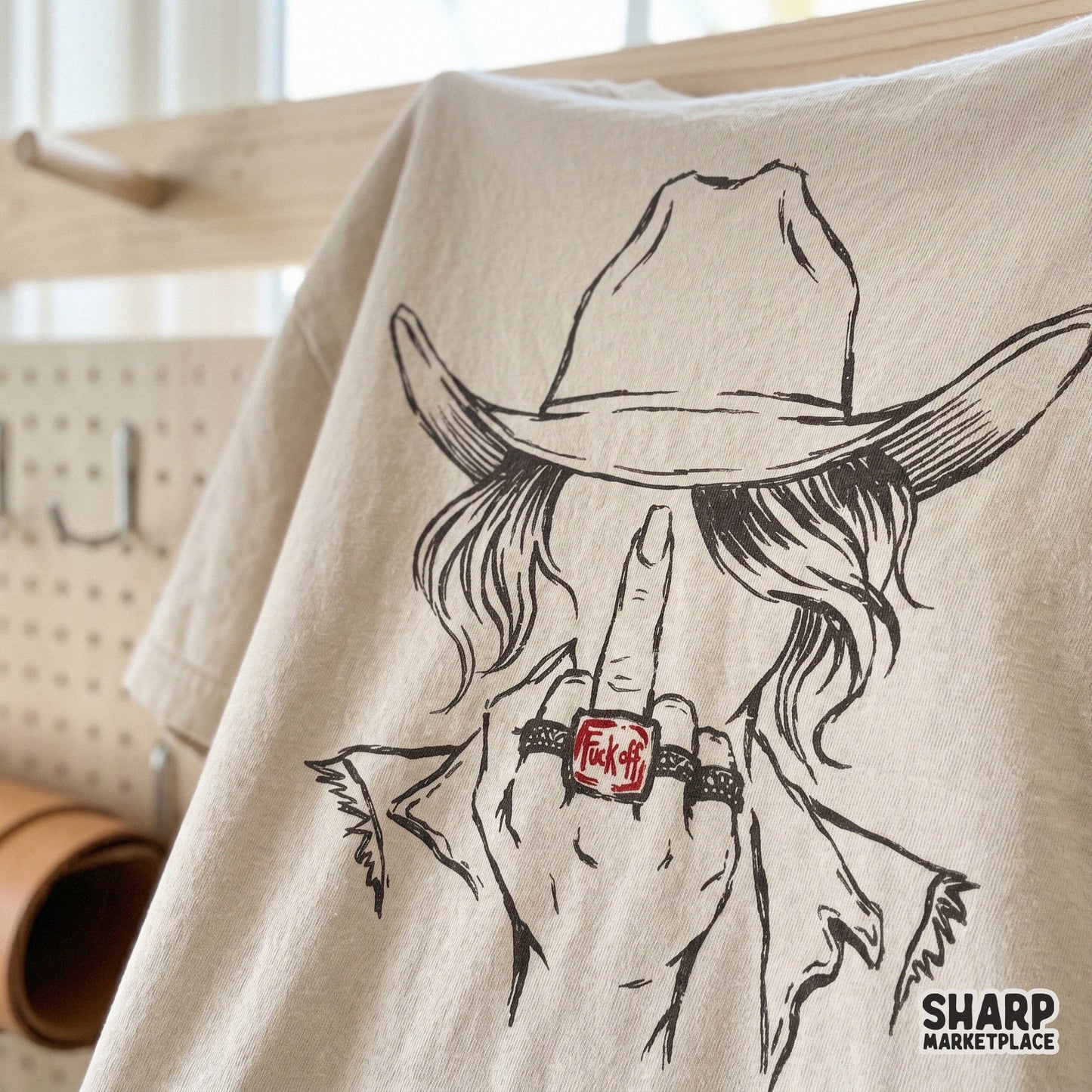 Bold western digital graphic of a cowgirl making a rude gesture, suitable for sublimation transfers, custom apparel, and unique gift creations.