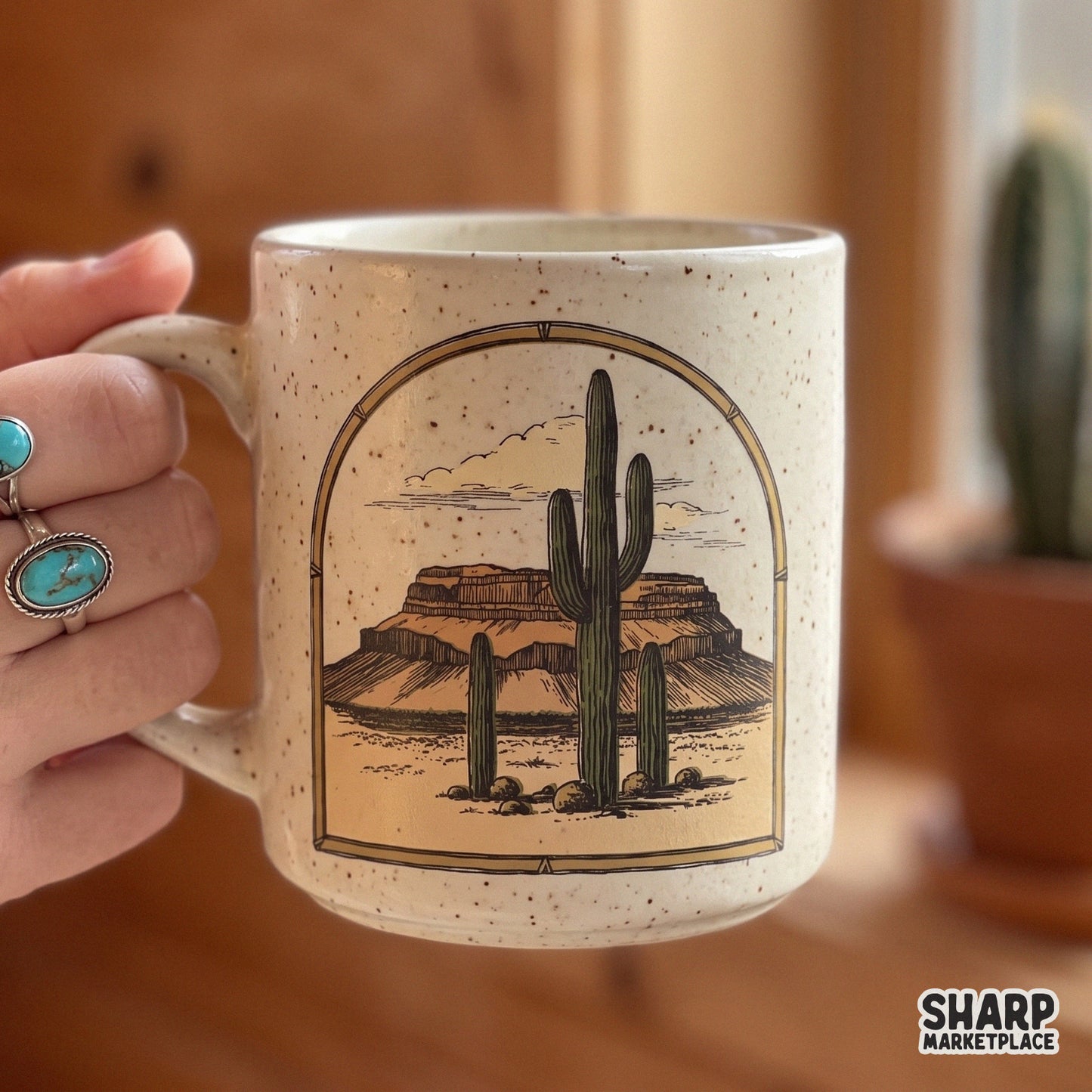 Vintage retro western png graphic featuring a desert landscape with saguaro cacti and a mesa view