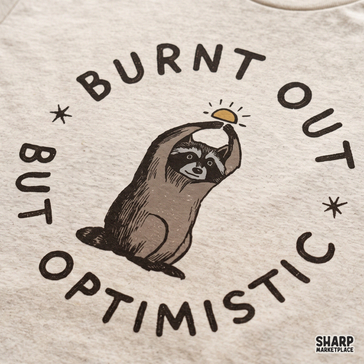 Cute burnt out but optimistic raccoon PNG design for retro t-shirts, sarcastic animal memes, and apparel crafts