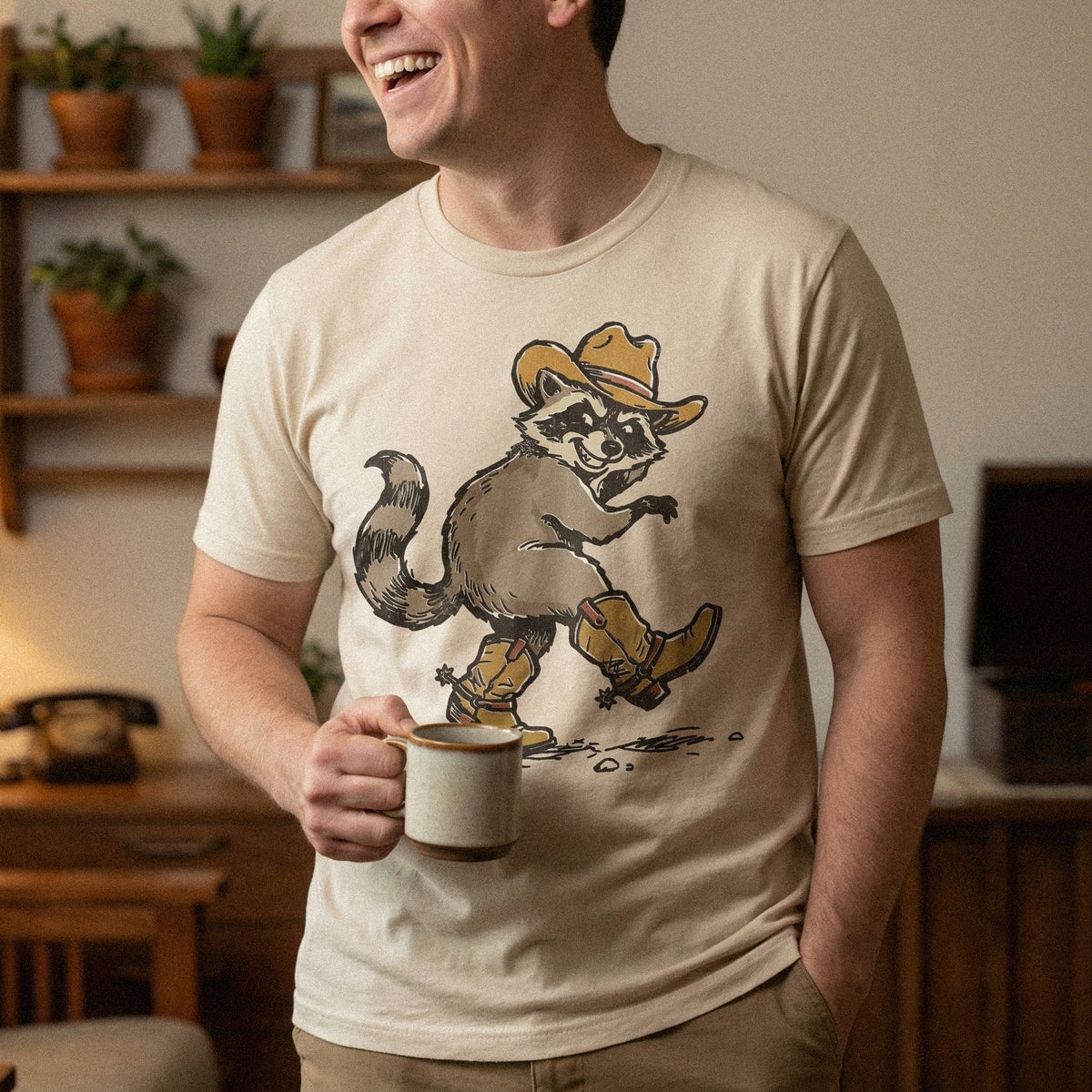 Digital download of a funny raccoon in cowboy boots and a hat, featuring a rustic desert aesthetic for stickers, tumblers, and western art prints.