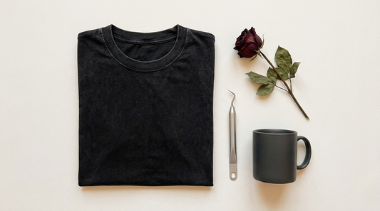 Flat lay of a black t-shirt with a skeleton Valentine design, surrounded by dark aesthetic props and crafting tools.