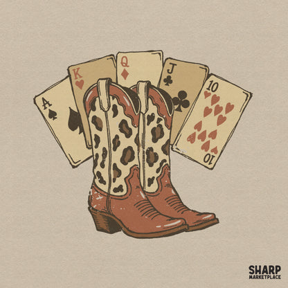 Retro western digital design featuring leopard print cowgirl boots in front of a winning fan of playing cards, perfect for rodeo t-shirt sublimation.