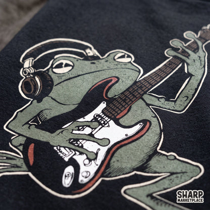 Edgy rocker frog wearing headphones and gas mask playing electric guitar PNG graphic design for music lovers