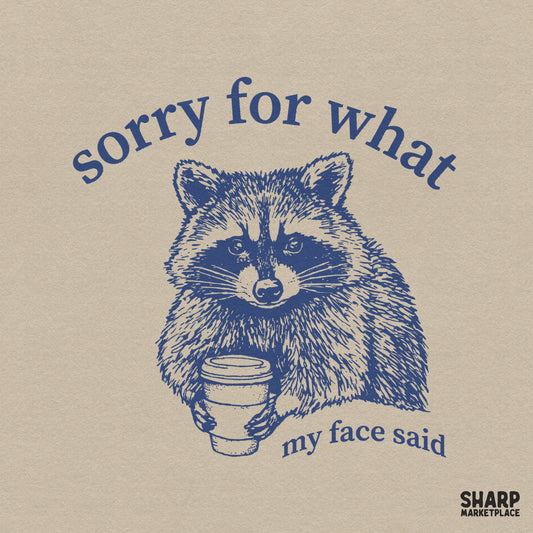Detailed blue ink illustration of a raccoon holding a coffee cup with the sarcastic quote Sorry for what my face said in vintage typography.