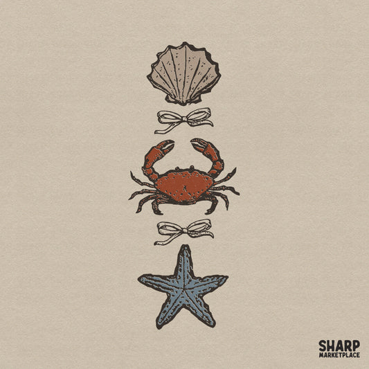 Vintage coastal sketch featuring a vertical stack of a scallop shell, red crab, and blue starfish separated by dainty bows for summer apparel.