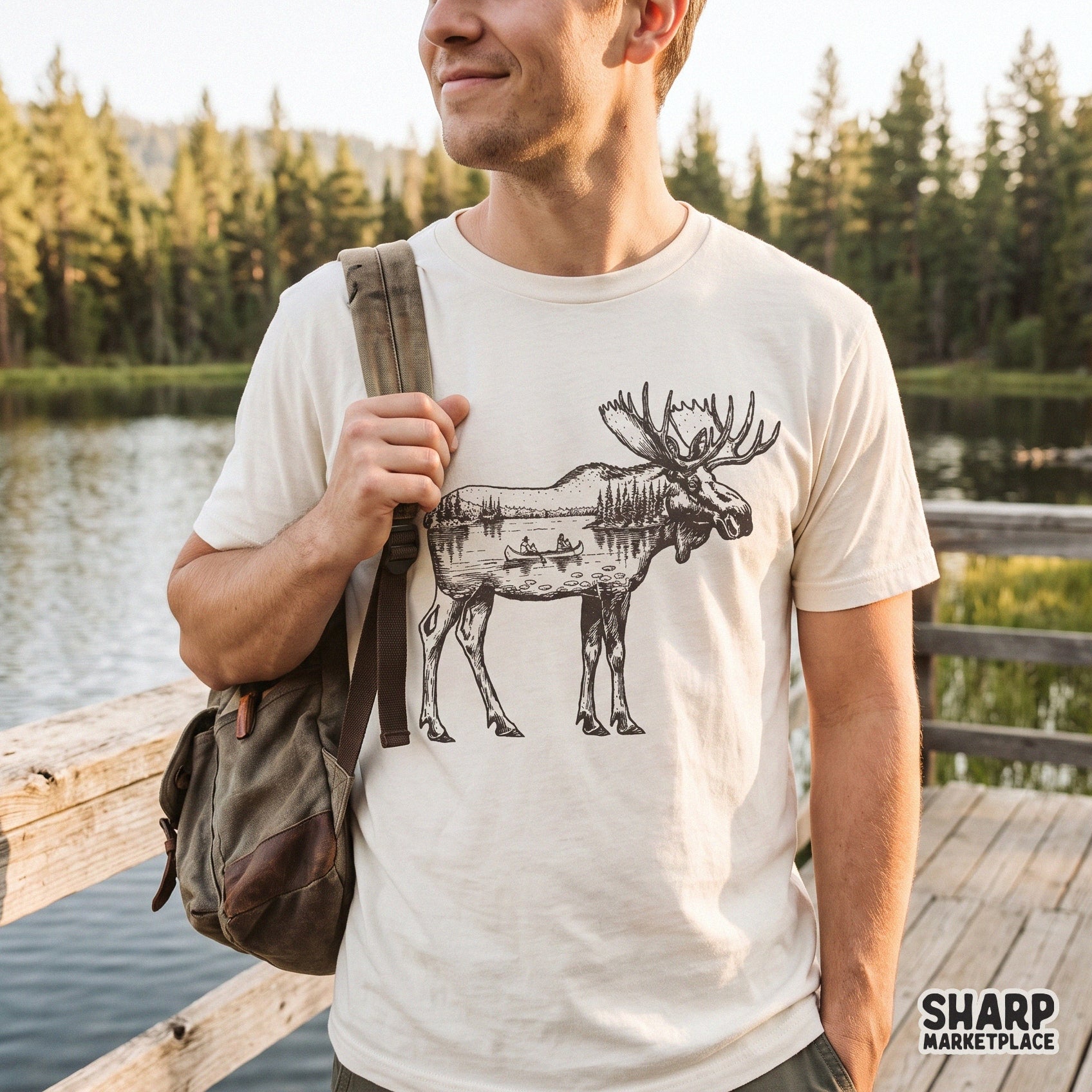 Vintage linocut moose double exposure nature sublimation design featuring a scenic canoe lake and pine trees