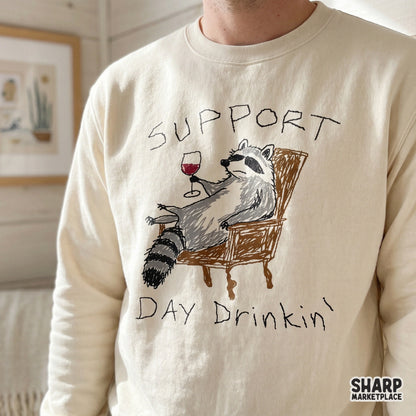 Funny raccoon in a chair illustration with wine, a retro-style sketch design suitable for DTF transfers, tumblers, and unique apparel customization.