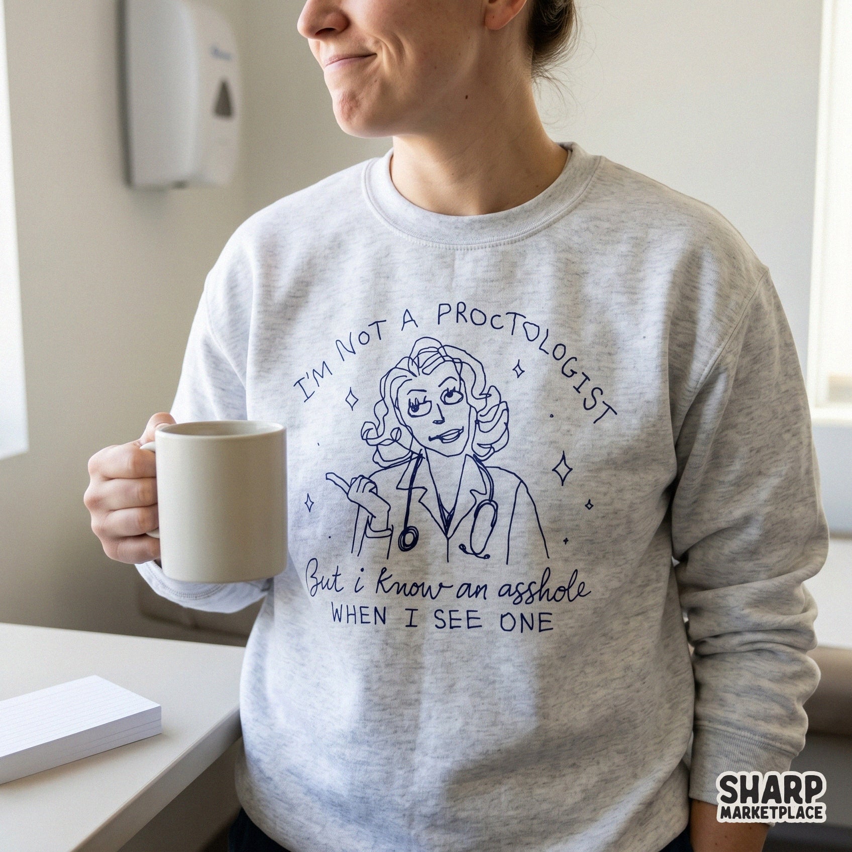 Sarcastic medical humor design featuring a doctor illustration and witty text, shown printed on a light gray sweatshirt for a trendy apparel look.