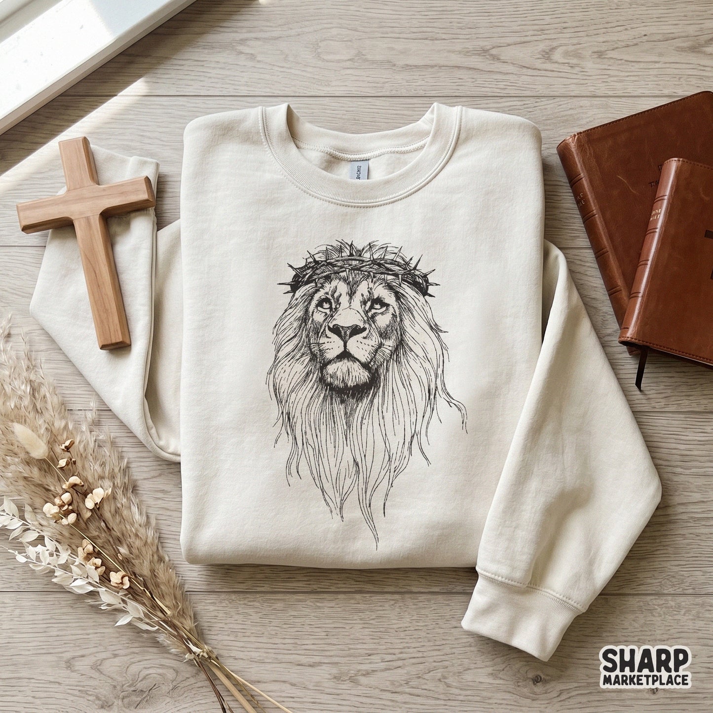 Hand-drawn lion portrait with a crown of thorns in a clean sketch style, suitable for religious wall art, stickers, and custom DIY gifts.