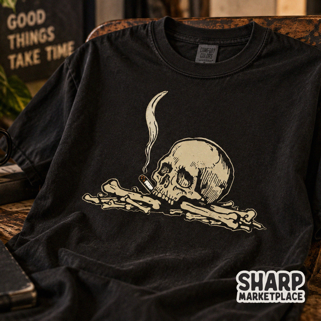 Edgy vintage gothic skull smoking a cigarette on a pile of bones illustration PNG for Halloween t-shirts and apparel