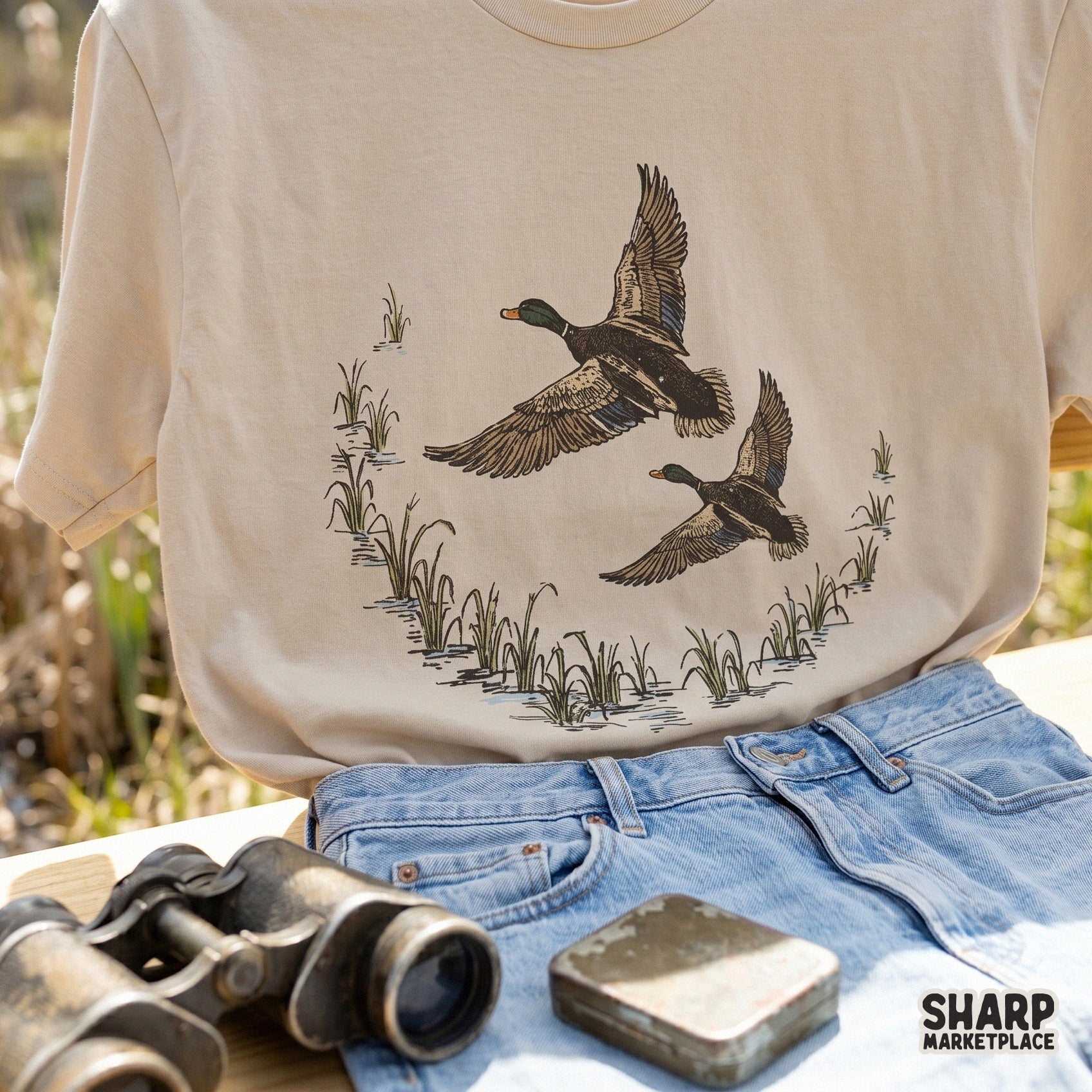 Hand-drawn mallard duck design in a marsh setting, suitable for summer hunting shirts, fishing gear, and custom printable apparel projects.