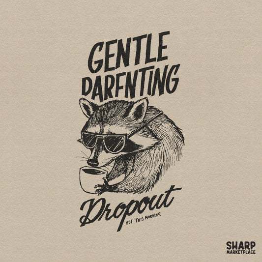 Hand-drawn raccoon wearing sunglasses and holding a coffee cup with the text Gentle Parenting Dropout in a distressed sketch style for apparel.