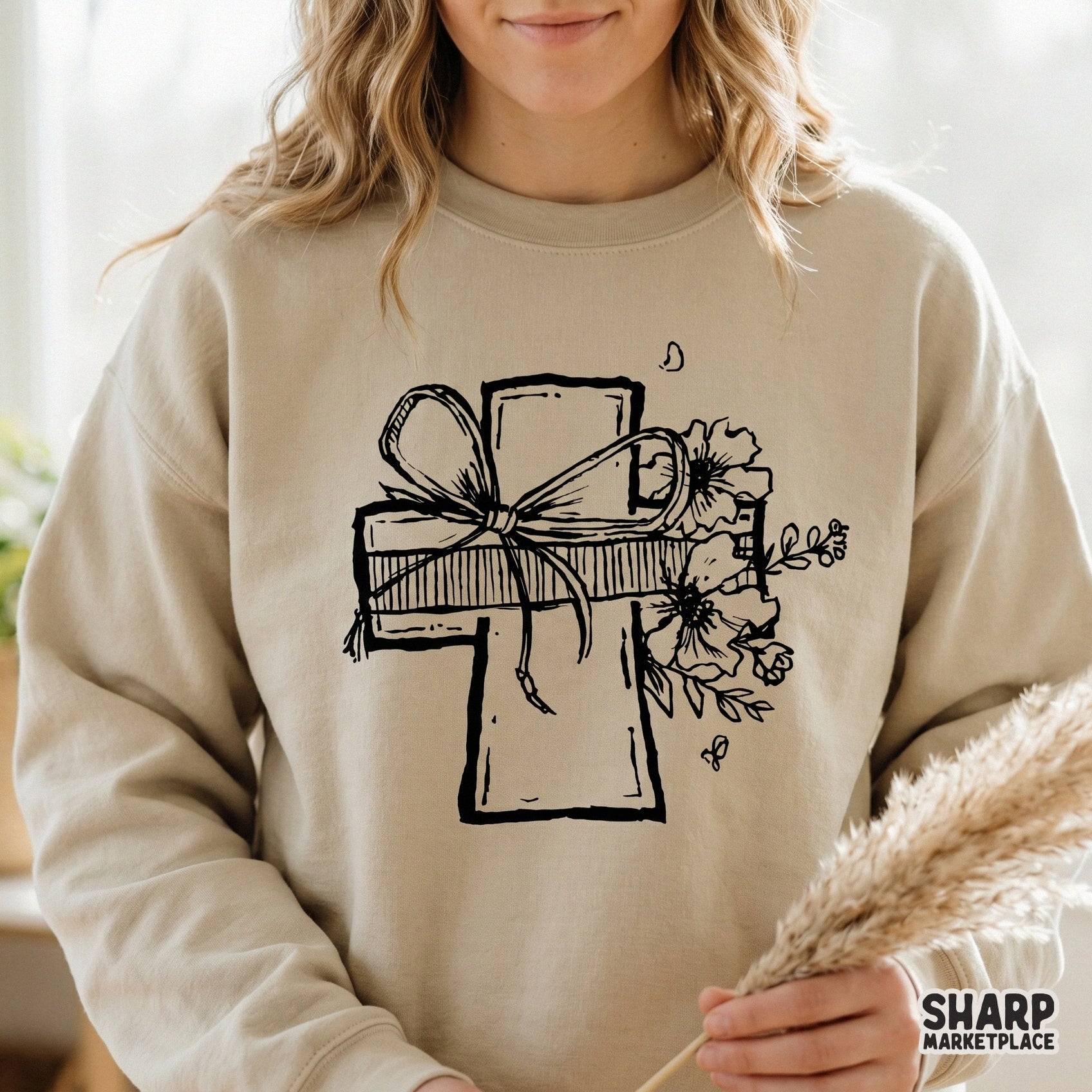 Black and white line art of a cross decorated with a ribbon bow and wildflowers, suitable for religious stickers, wall art, or DIY craft projects.