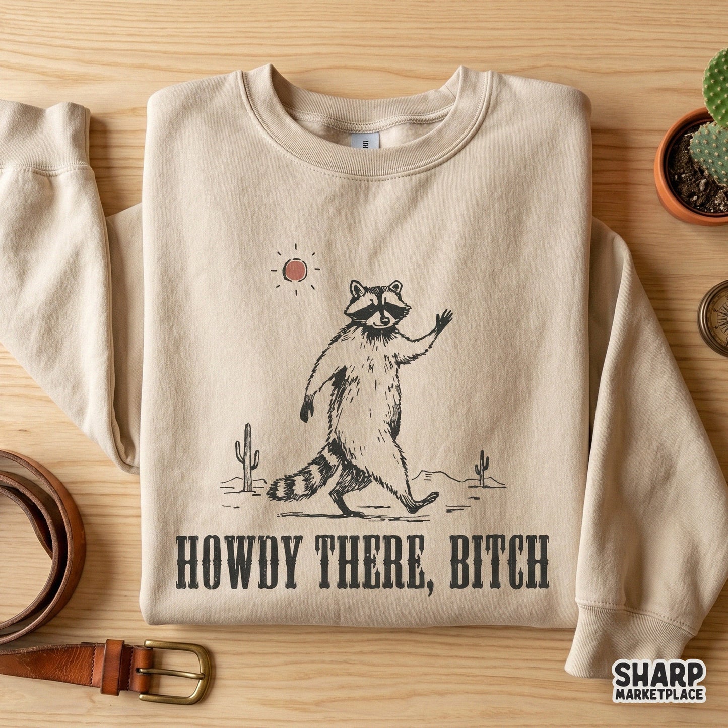 Sarcastic desert-themed raccoon illustration with western block typography, ideal for creating humorous stickers, tumblers, and apparel designs.
