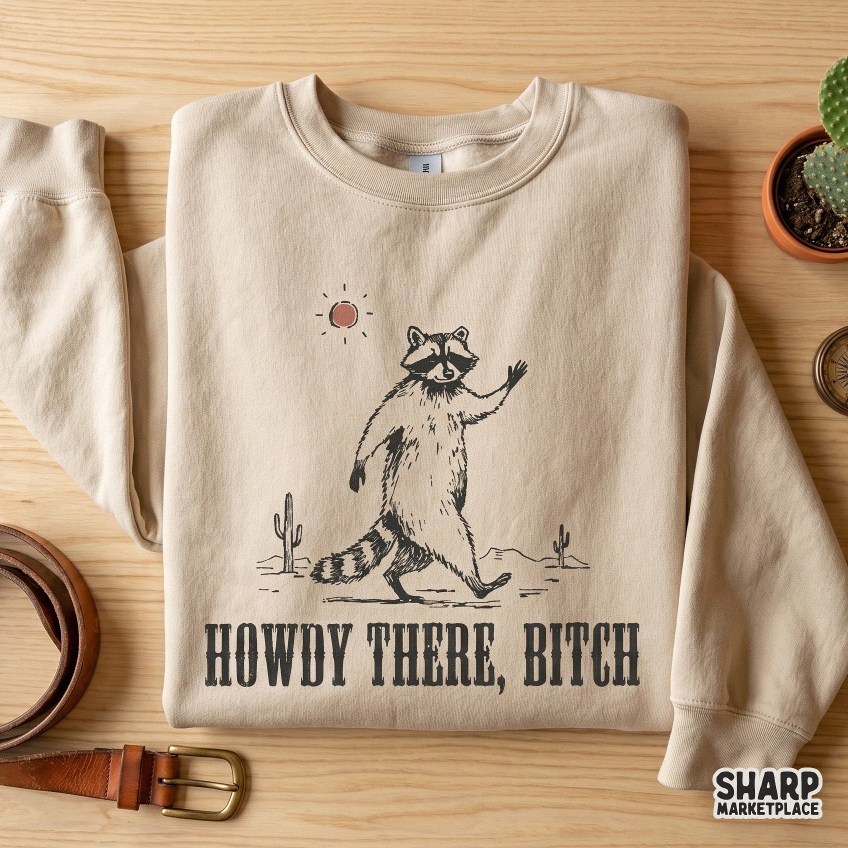 Sarcastic desert-themed raccoon illustration with western block typography, ideal for creating humorous stickers, tumblers, and apparel designs.