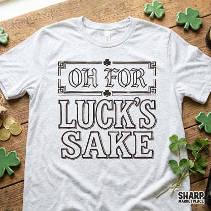 Retro St. Patrick's Day design featuring the funny phrase Oh For Luck's Sake in distressed typography, displayed on a light heather gray t-shirt.