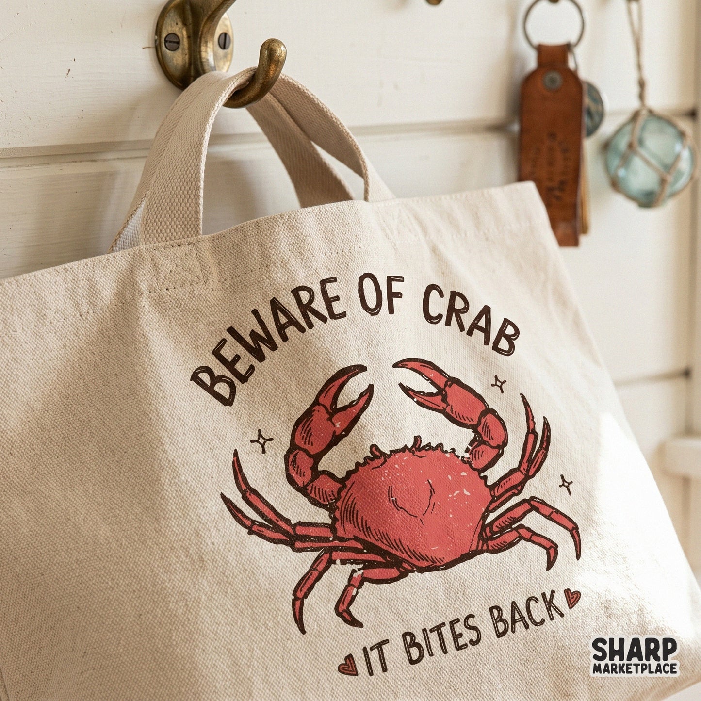 Playful beach-themed digital art featuring a red crab and the warning It Bites Back, suitable for creating trendy summer t-shirts and wall decor.