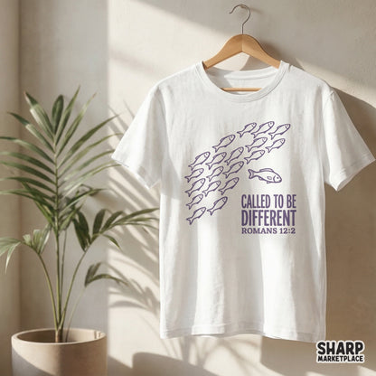Sublimation design with purple hand-drawn fish and distressed block typography reading Called To Be Different Romans 12:2 for apparel and DIY projects.
