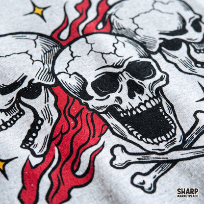 Three screaming skulls with burning red flames and crossbones edgy biker tattoo flash clipart for spooky Halloween t-shirts