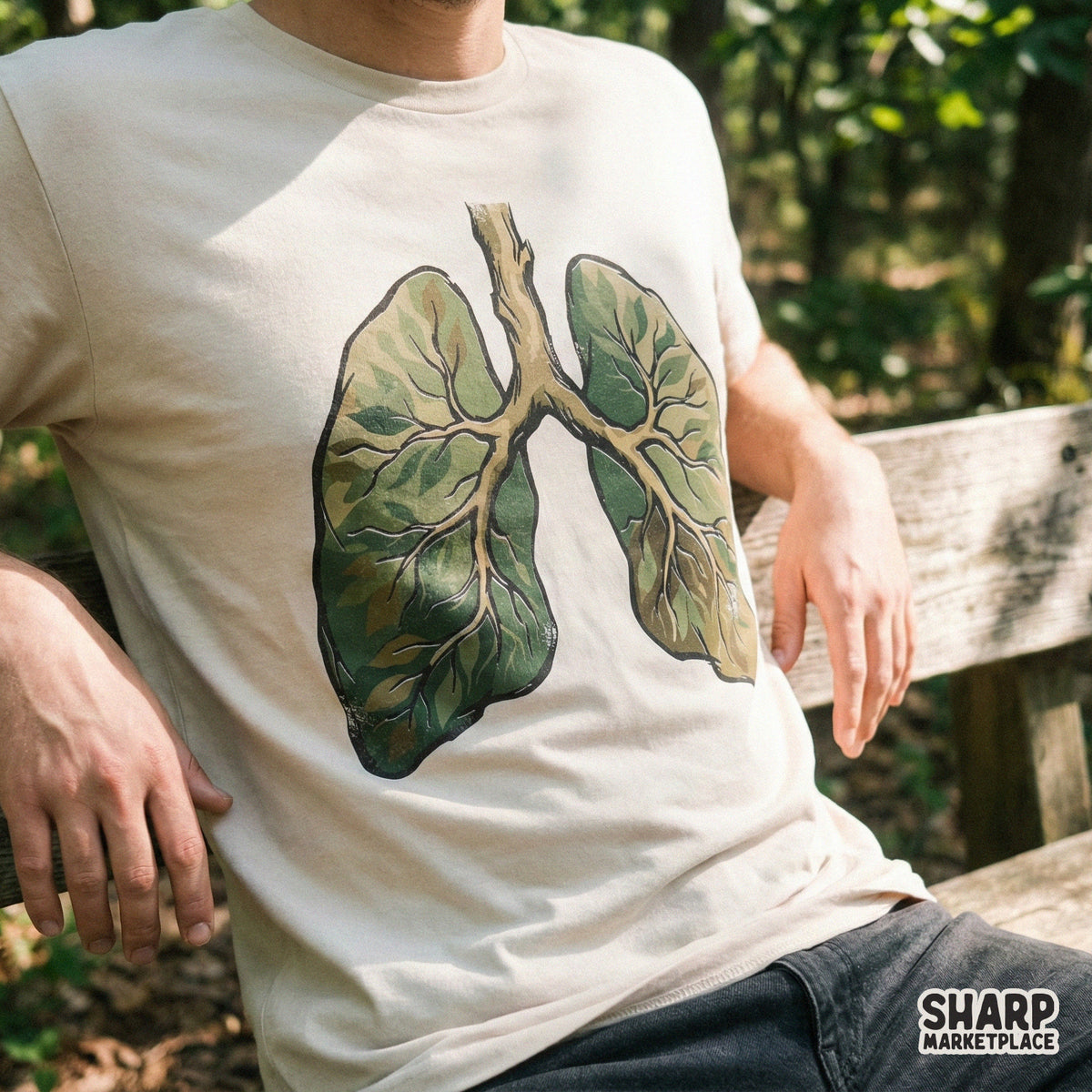 A beige t-shirt mockup showcasing a botanical lungs design with green foliage and organic branch textures for eco-friendly apparel printing.