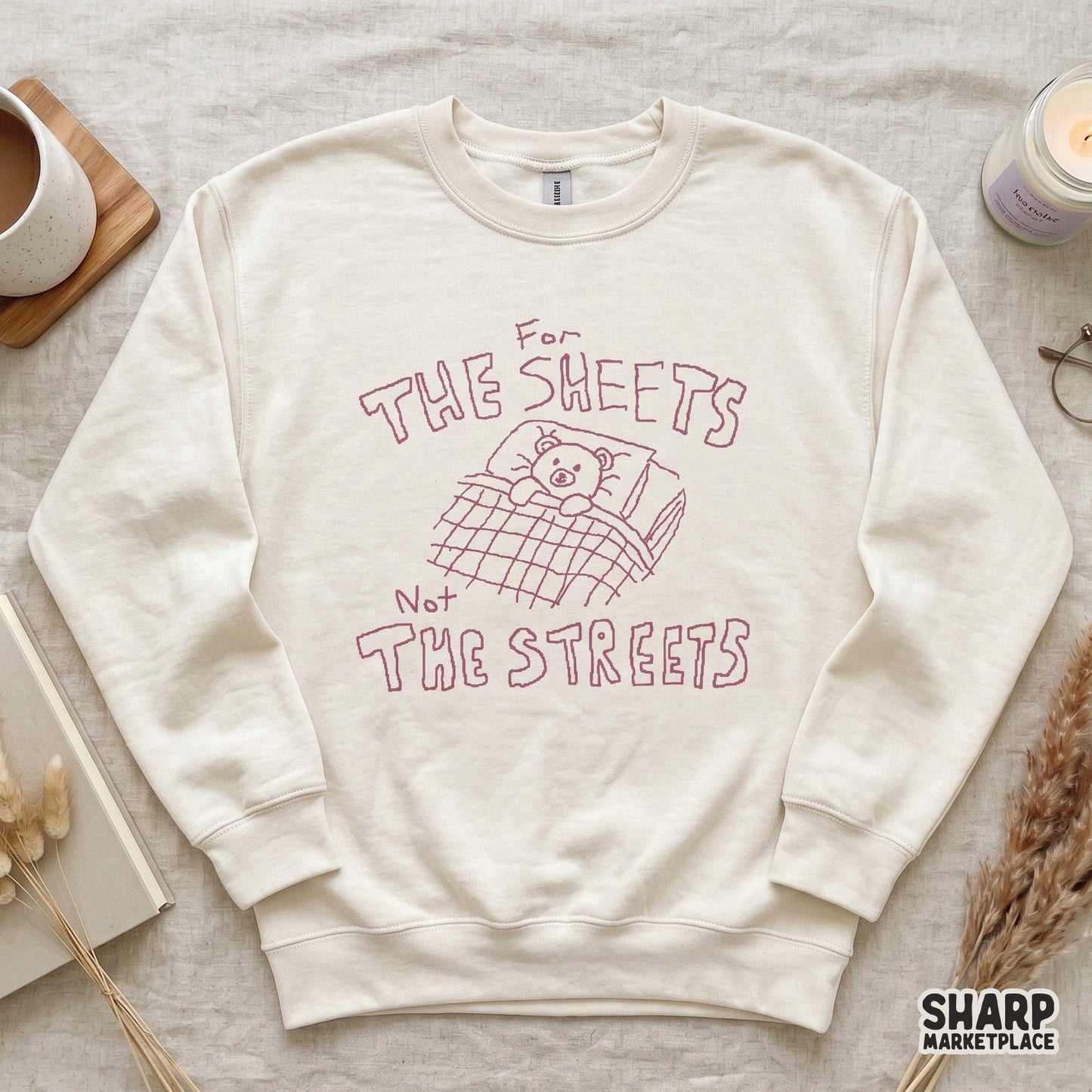 Minimalist digital graphic with a pink outline of a teddy bear in bed, perfect for custom sublimation shirts, stickers, and nursery decor projects.