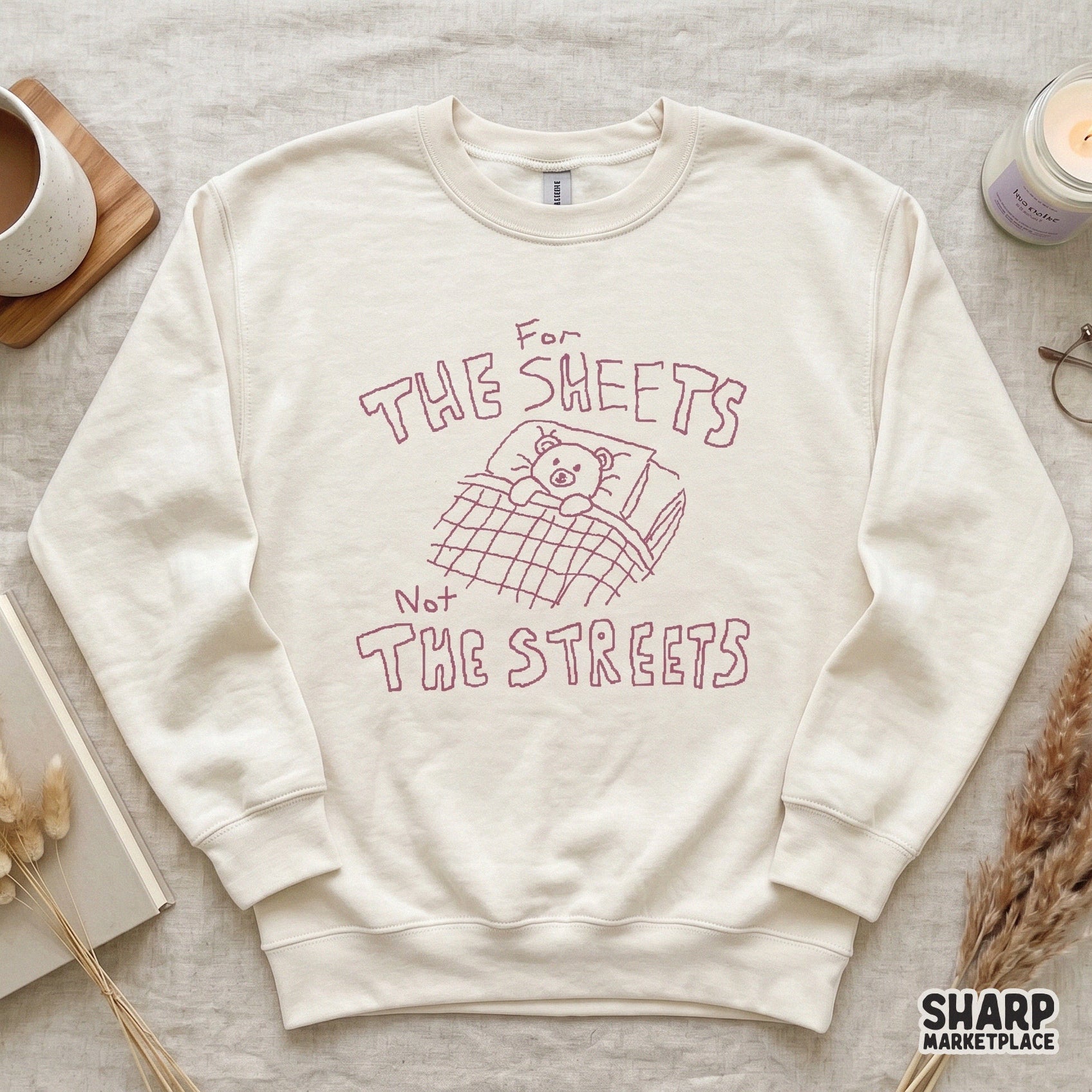 Minimalist digital graphic with a pink outline of a teddy bear in bed, perfect for custom sublimation shirts, stickers, and nursery decor projects.