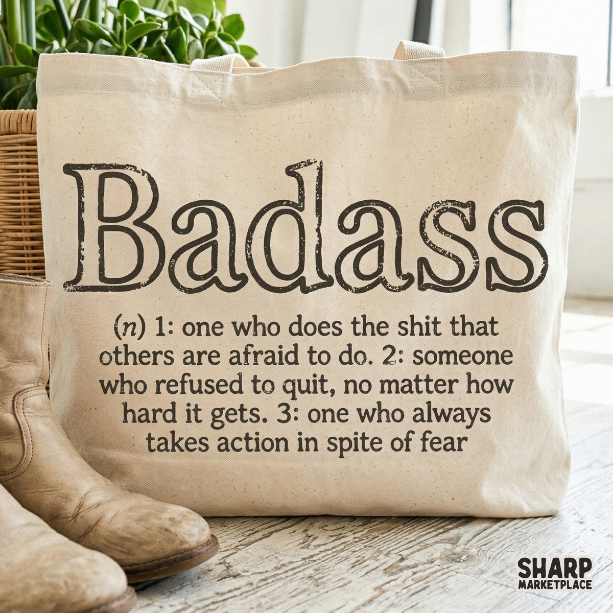 Digital typography design for apparel featuring a sarcastic and bold definition of Badass in a vintage, distressed typewriter font style.