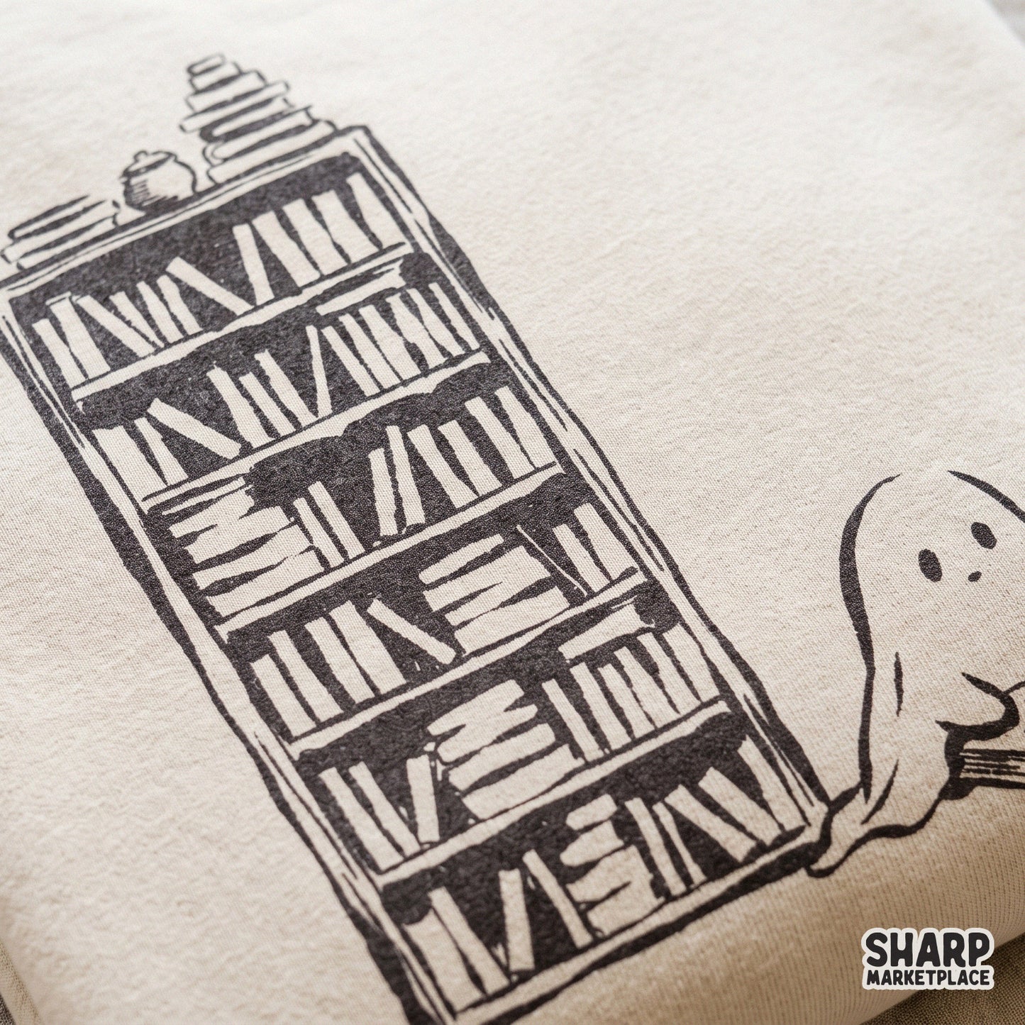 Cute ghost reading a book by a bookshelf with a cat cozy spooky season retro Halloween PNG design for autumn t-shirts