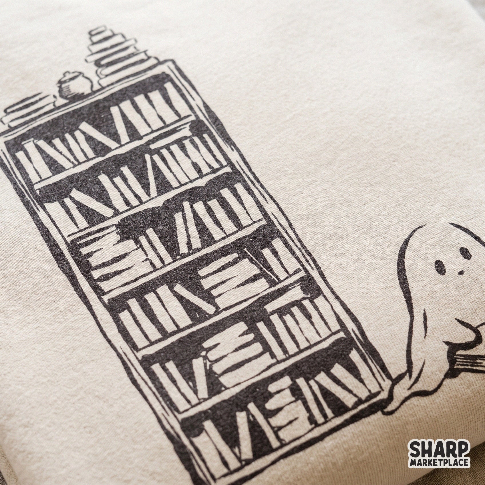 Cute ghost reading a book by a bookshelf with a cat cozy spooky season retro Halloween PNG design for autumn t-shirts