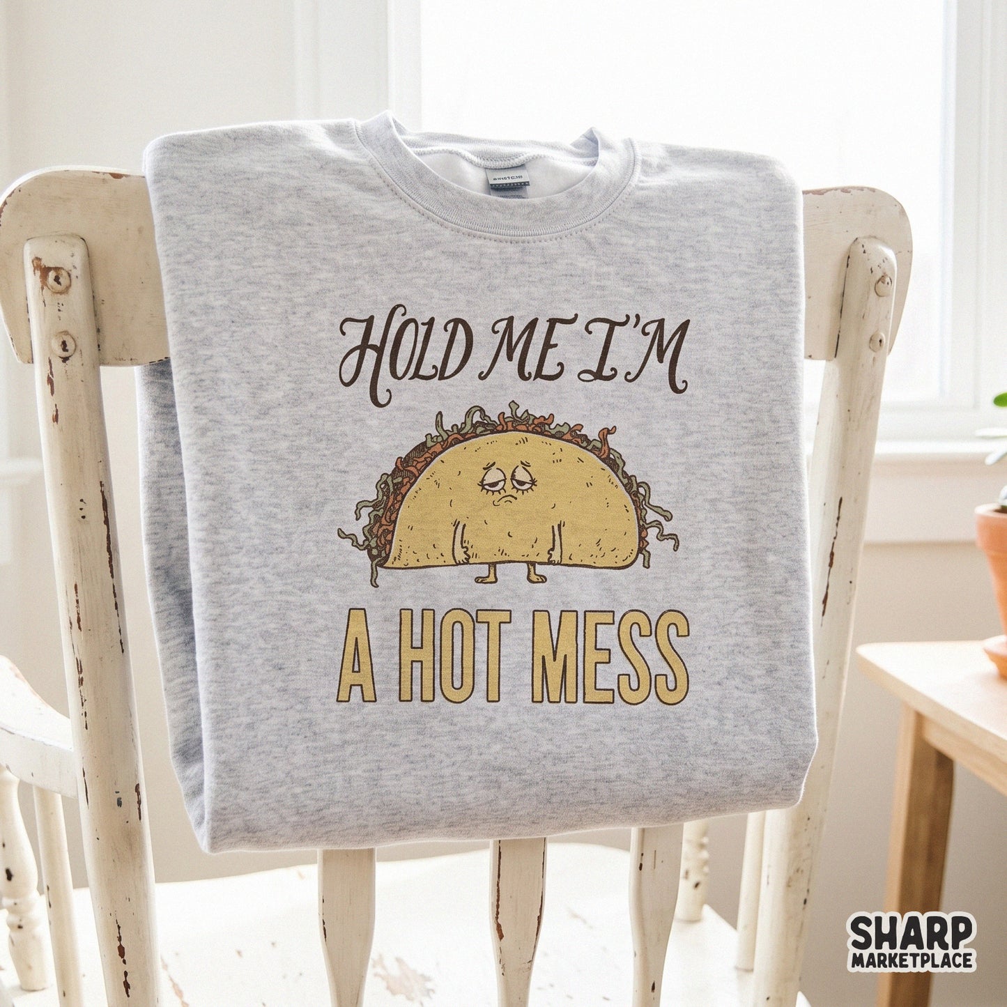 Sarcastic sad taco character with Hold Me I'm a Hot Mess text in retro Y2K style for funny apparel sublimation designs