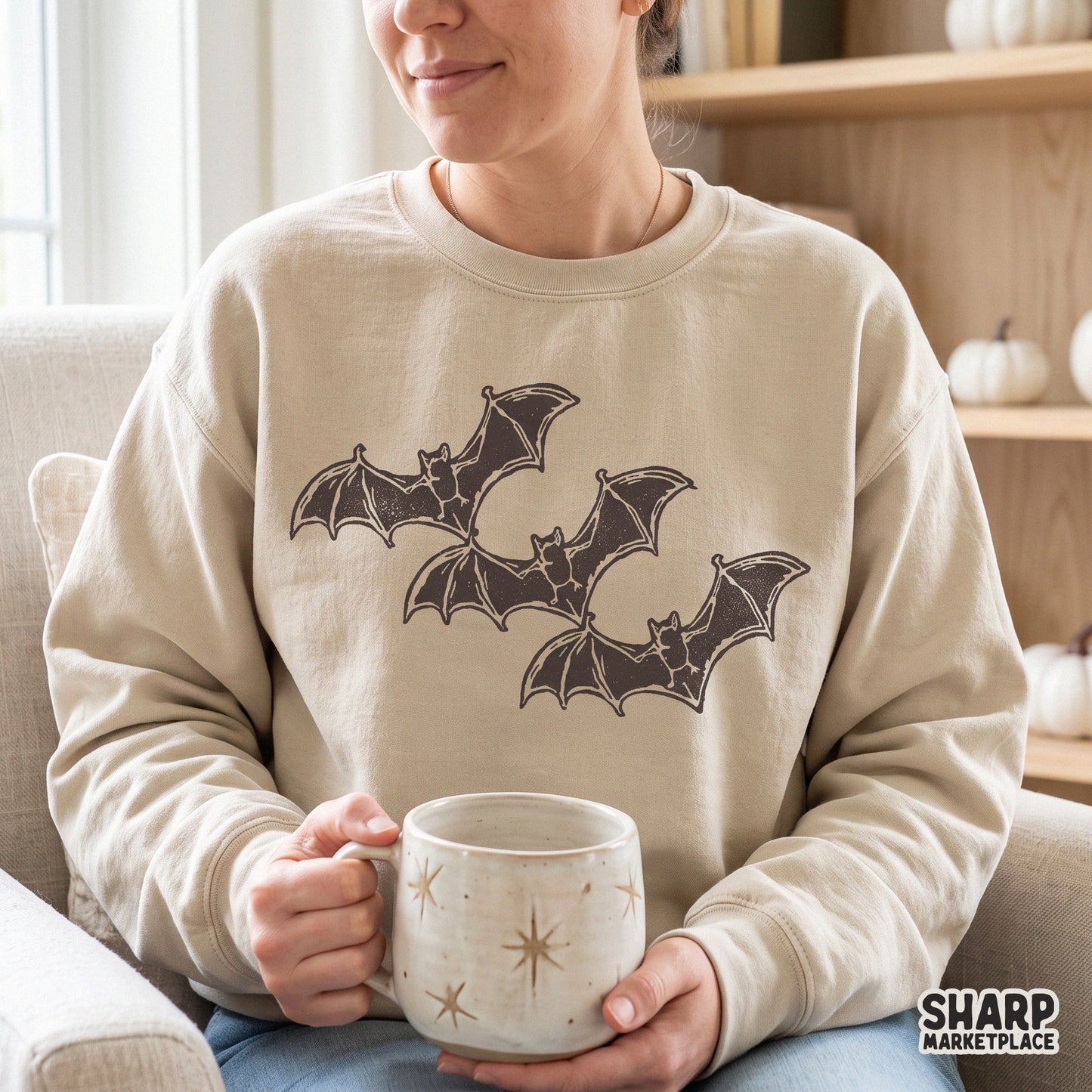 Vintage block print of three flying bats for spooky season sublimation shirts and retro Halloween stickers