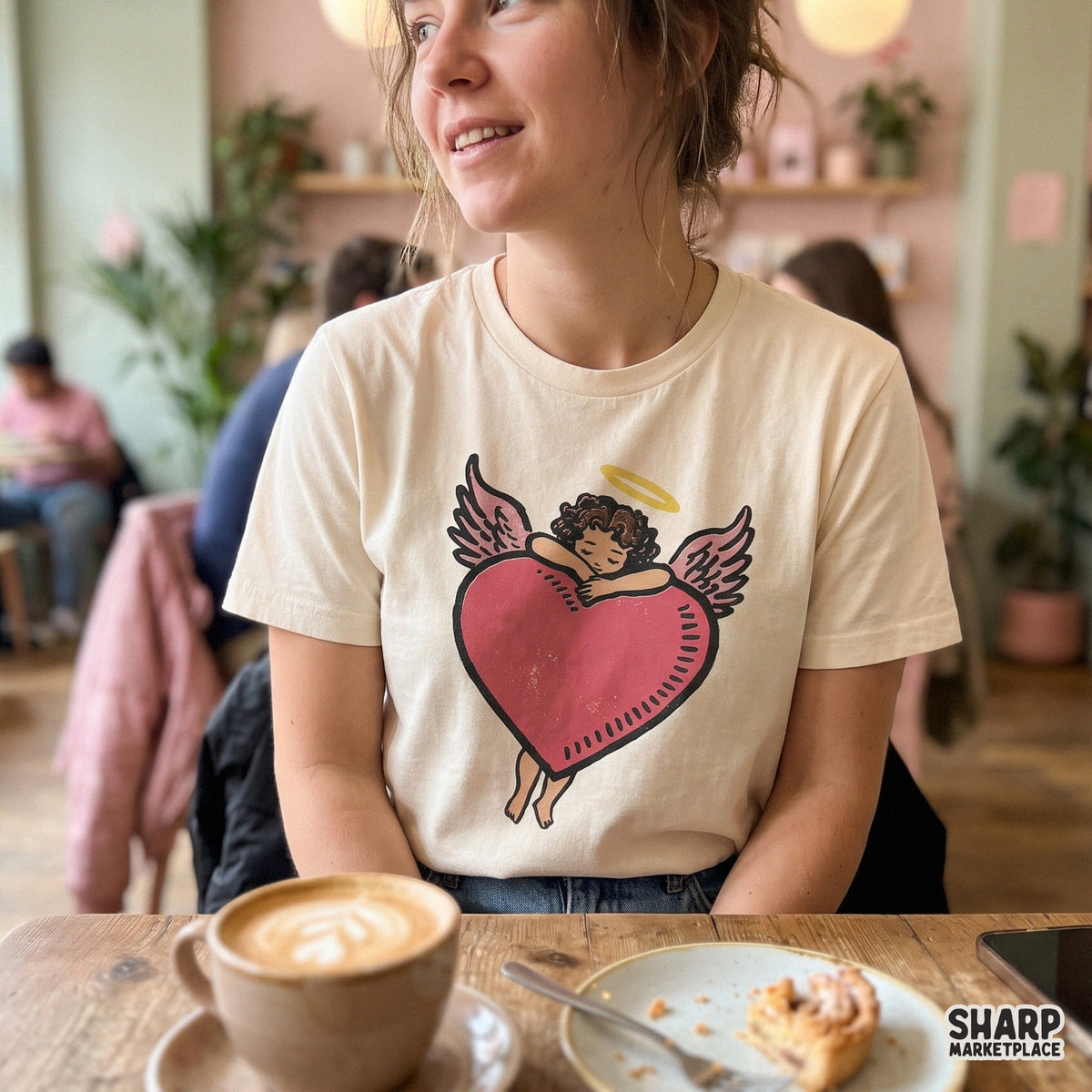 Vintage cherub angel hugging a red heart cute cupid PNG graphic for Valentine's Day t-shirts and sublimation