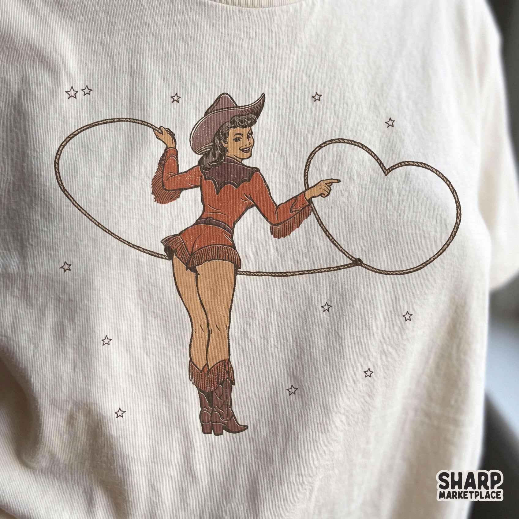 Vintage pinup cowgirl throwing a heart rope lasso in a retro western style Valentine's Day sublimation design