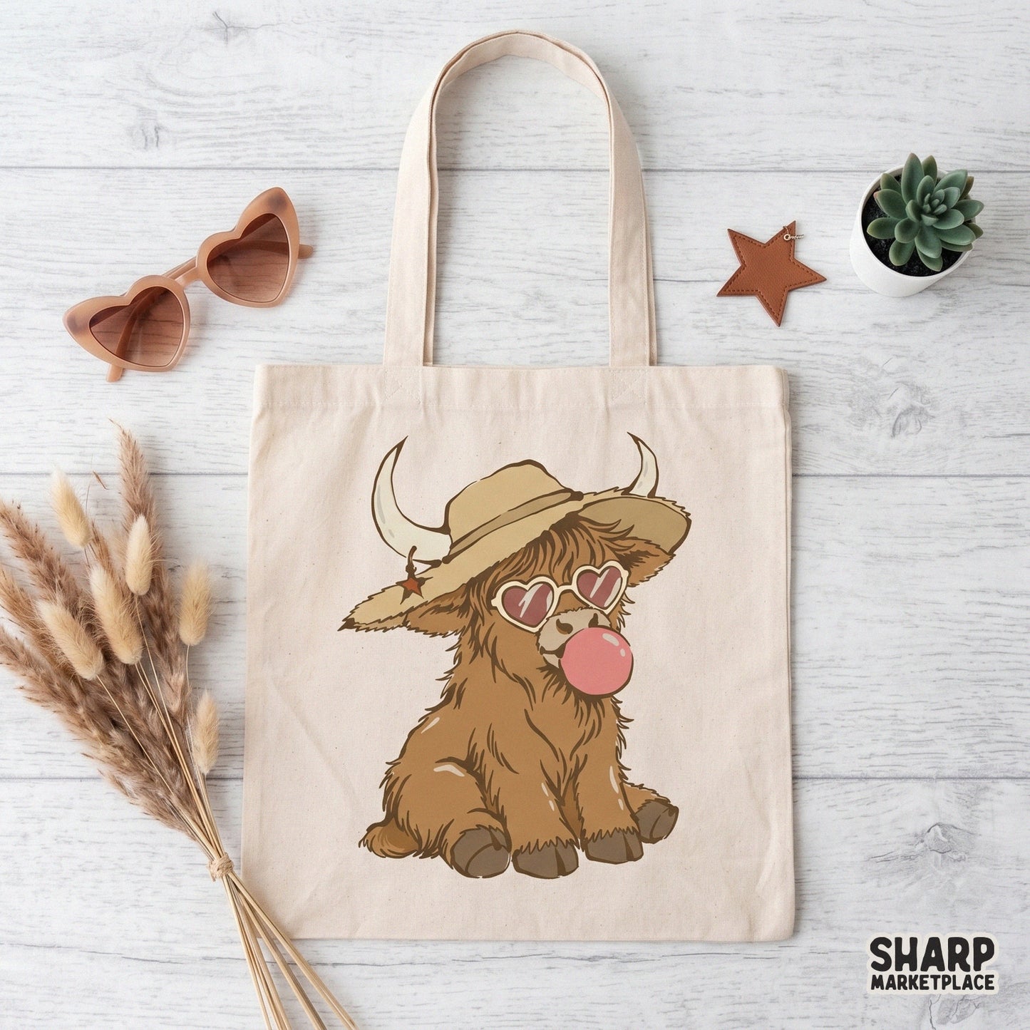 Whimsical farm animal digital design of a baby highland cow in a cowboy hat and heart shades, perfect for custom shirts and DIY craft projects.