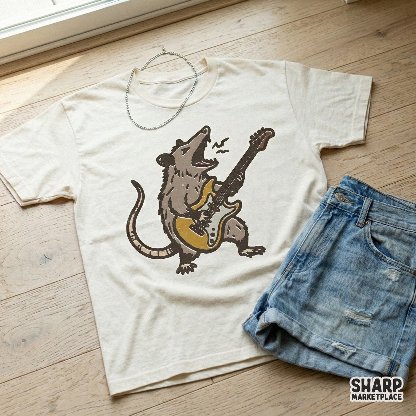 Retro graphic of a rock and roll opossum strumming a yellow guitar, perfect for custom apparel, stickers, or music-themed DIY craft projects.