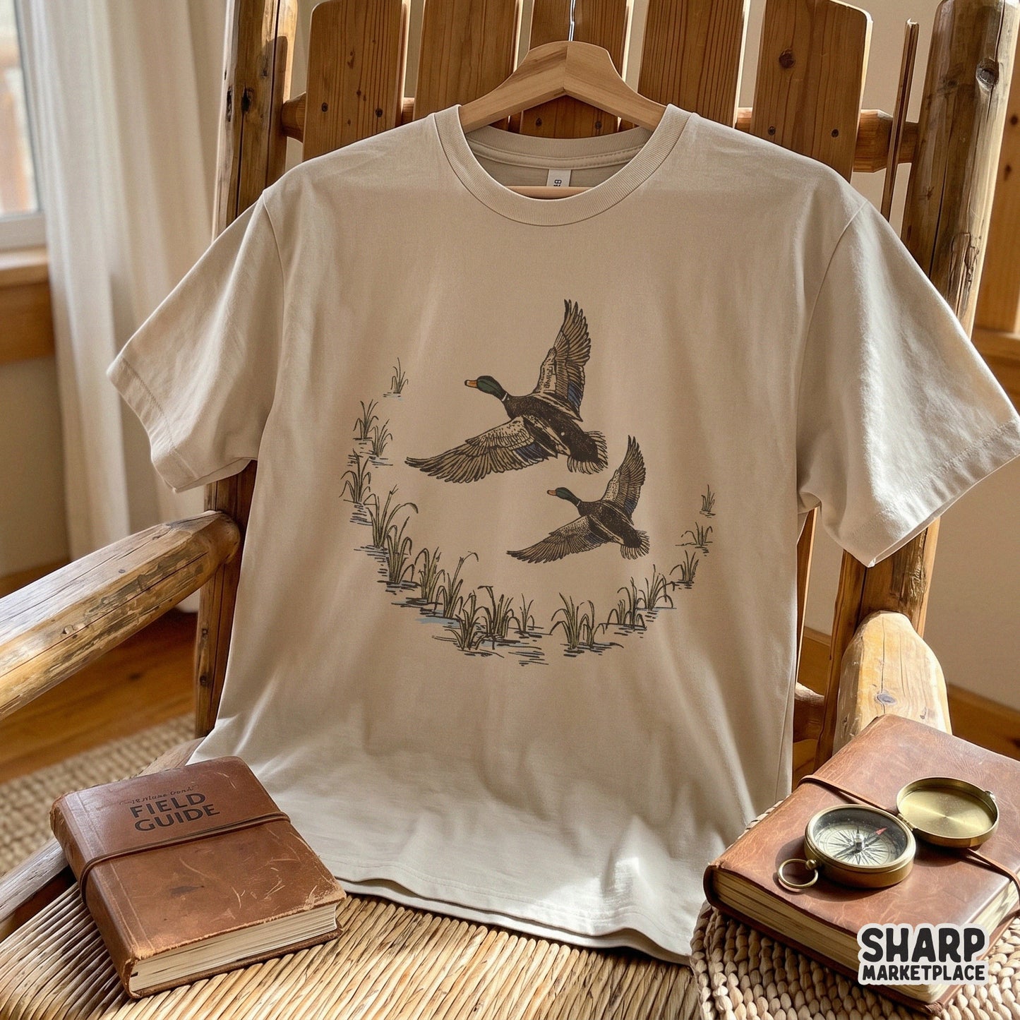 Vintage-style mallard duck illustration with green heads and brown wings, perfect for custom lake cabin t-shirts and rustic DIY gifts.