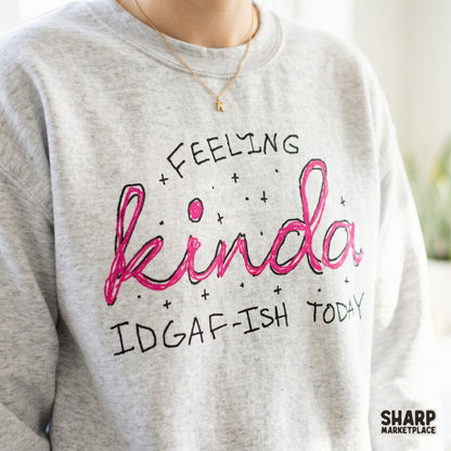 Sassy digital quote design featuring Feeling Kinda IDGAF-Ish Today in pink script with decorative stars, great for custom print-on-demand items.