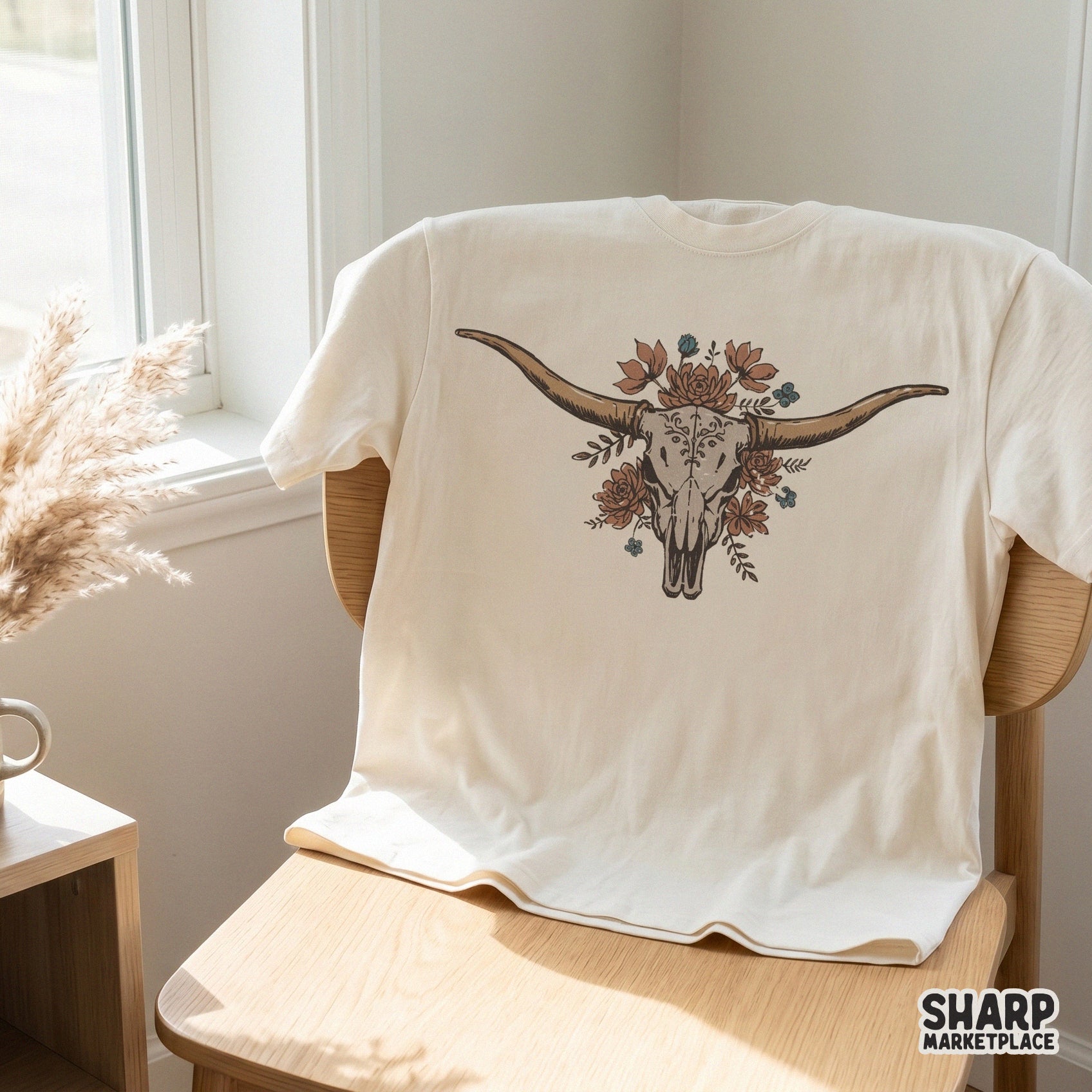 Rustic cattle skull illustration with desert succulents and floral accents, ideal for creating custom western-themed t-shirts, tumblers, and stickers.