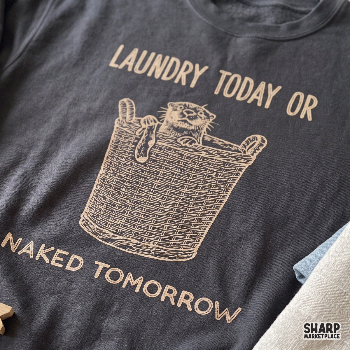 Funny otter in laundry basket graphic with Laundry Today or Naked Tomorrow sarcastic quote for shirts and apparel
