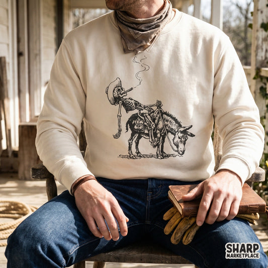 Detailed line art design of a relaxed outlaw skeleton on a donkey, shown printed on a cream-colored crewneck sweatshirt.